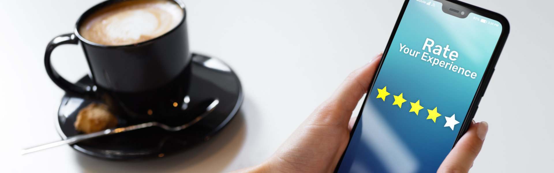 Coffee and review icons on cellphone